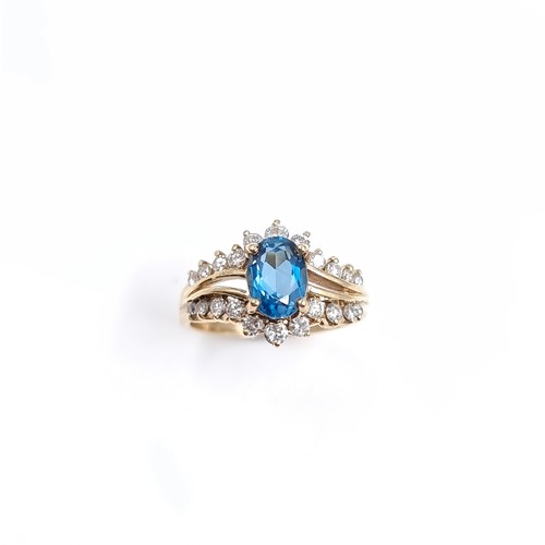6 - A very pretty nine carat Gold Diamond and Topaz ring. Size - H 1/2, Weight - 2.23 grams.