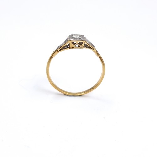 53 - Star Lot : An antique 18 carat gold ring set with Diamond and Diamond shoulder mounts. Stamped 18CT.... 
