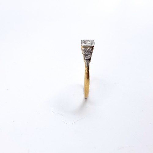53 - Star Lot : An antique 18 carat gold ring set with Diamond and Diamond shoulder mounts. Stamped 18CT.... 