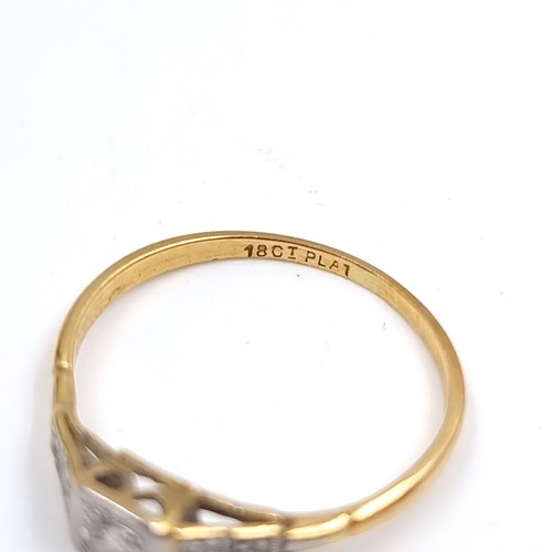 53 - Star Lot : An antique 18 carat gold ring set with Diamond and Diamond shoulder mounts. Stamped 18CT.... 