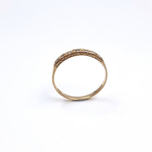 48 - A pretty antique nine carat Gold Diamond set half eternity ring . Size - O 1/2, Weight-  1. 42 grams