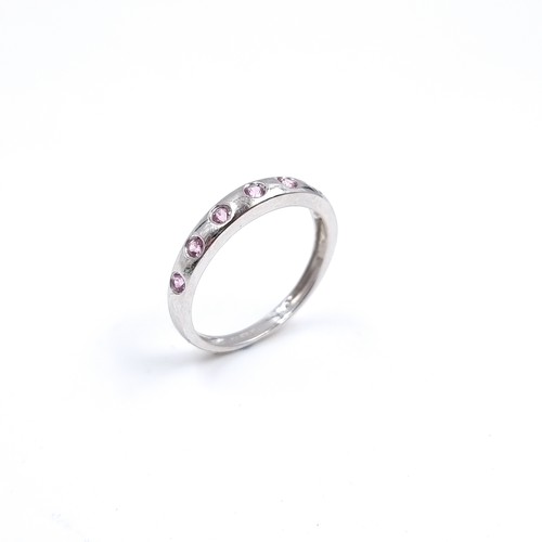 47 - Star Lot : A nine carat white gold pink Topaz set ring. Size - O 1/12, Weight - 1.87 grams.