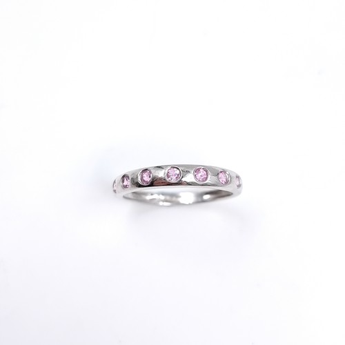 47 - Star Lot : A nine carat white gold pink Topaz set ring. Size - O 1/12, Weight - 1.87 grams.