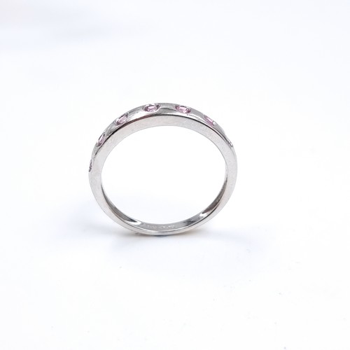 47 - Star Lot : A nine carat white gold pink Topaz set ring. Size - O 1/12, Weight - 1.87 grams.