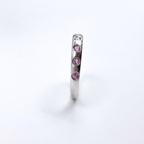 47 - Star Lot : A nine carat white gold pink Topaz set ring. Size - O 1/12, Weight - 1.87 grams.