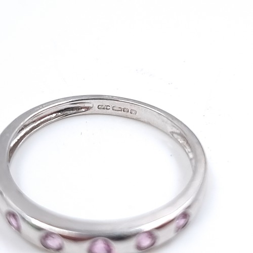 47 - Star Lot : A nine carat white gold pink Topaz set ring. Size - O 1/12, Weight - 1.87 grams.