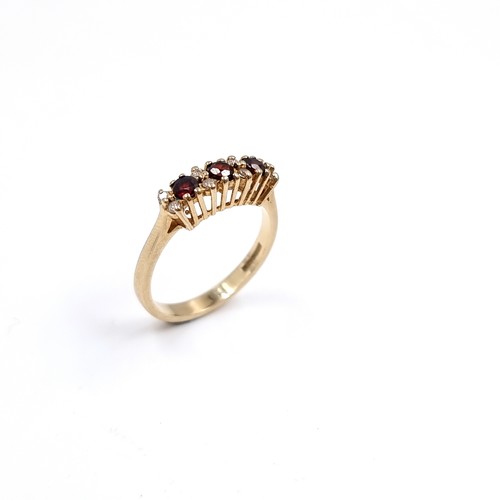 43 - Star Lot : A Three Garnet and White Tourmaline 375 nine carat gold. Size - P, Weight - 2.73 grams.