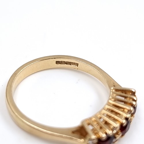 43 - Star Lot : A Three Garnet and White Tourmaline 375 nine carat gold. Size - P, Weight - 2.73 grams.