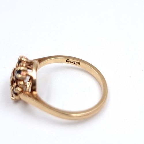 41 - Star Lot : A Diamond and Sapphire daisy style ring set in 375 nine carat gold. Size - L, Weight - 2.... 