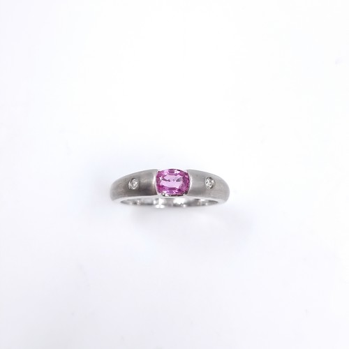 40 - Star Lot : A nine carat white gold ring set with a Pink Sapphire and two Diamonds. Size - P, Weight ... 