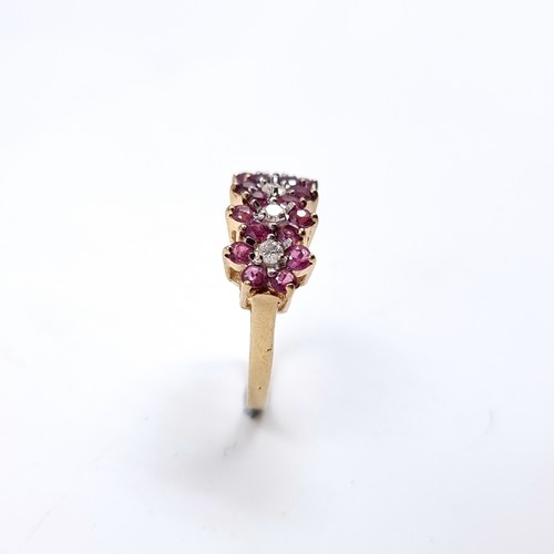 34 - Star Lot : A nine carat gold Ruby and Diamond gemstone ring. Size - K, Weight - 2.45 grams.