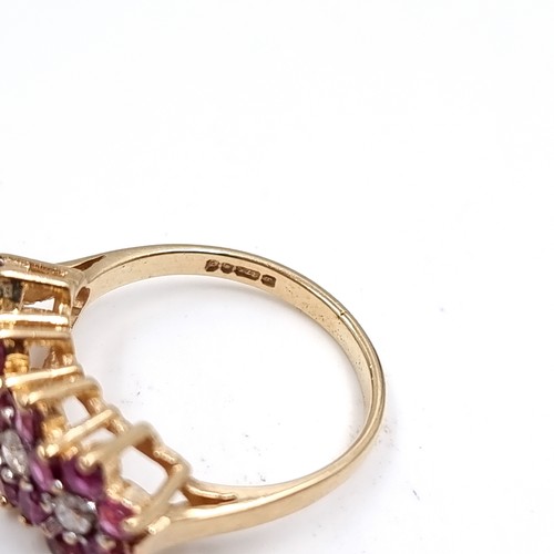 34 - Star Lot : A nine carat gold Ruby and Diamond gemstone ring. Size - K, Weight - 2.45 grams.