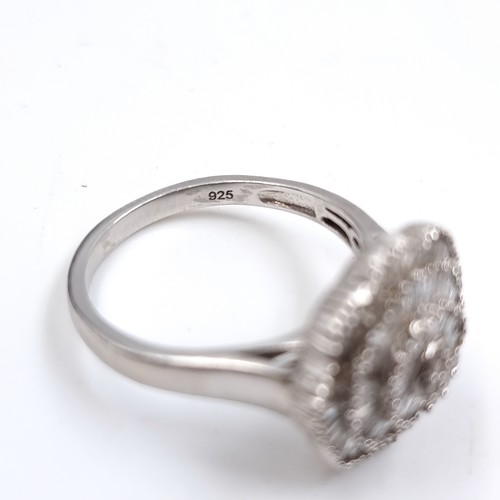 31 - Star Lot : A Stunning Large Diamond spray set ring. Est Weight of Diamonds - 0.45 carats, Size - T. ... 