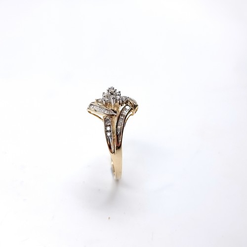 7 - Star Lot : A fabulous nine carat gold Diamond cluster ring with Diamond set shoulders. Size - U 1/2,... 