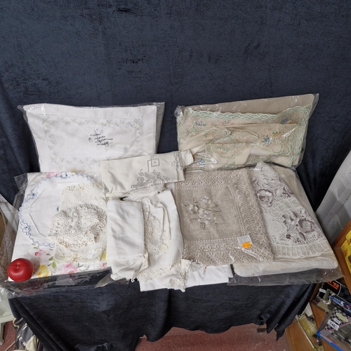 Approx 10 embroidered linen and cotton table cloths. Some very pretty ...
