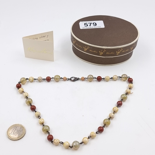 An unusual multi semi precious stone necklace with lobster clasp. 46cm Length. Weight 30g. All cold to the touch in A rhinestones Dubin box.
