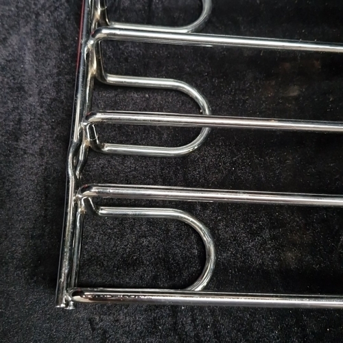 Brand new Chrome-plated steel wall-mounted wire rack providing seven ...
