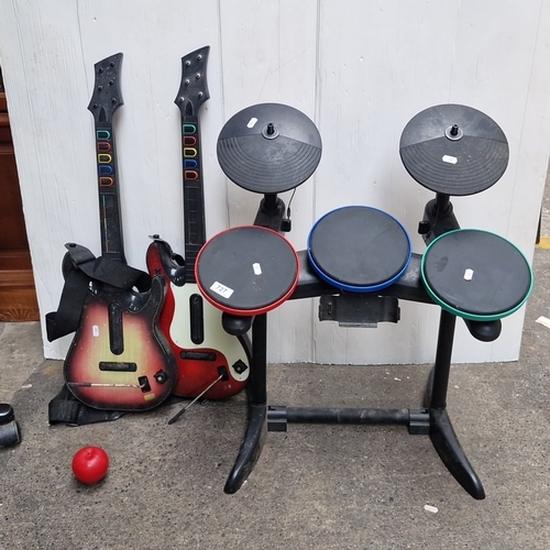 Group of three video-game instrument controllers comprising a Rock Band ...