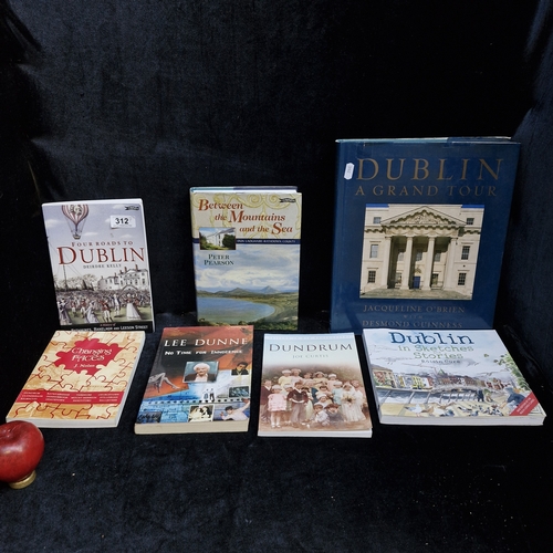 A selection of seven hardback and soft cover books. All in Irish ...