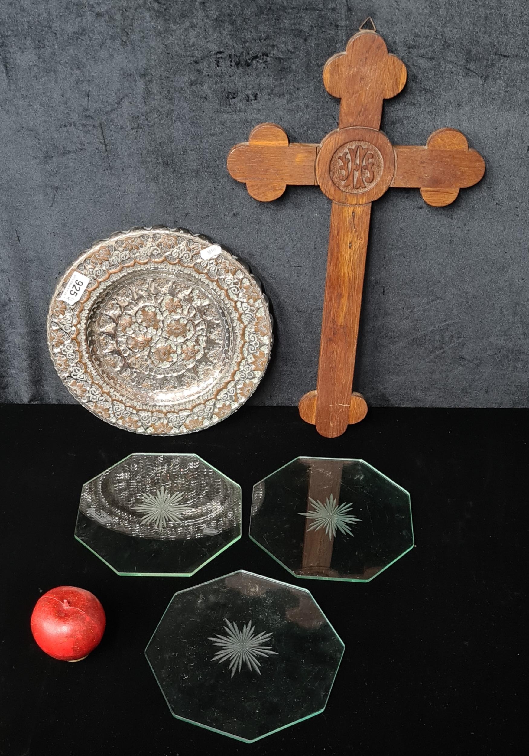 Five items including three glass octagonal trivets, a carved wooden ...