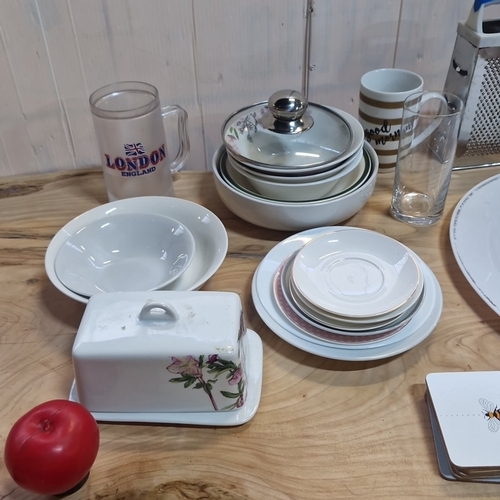 Collection of assorted kitchen and tableware including plates, bowls ...