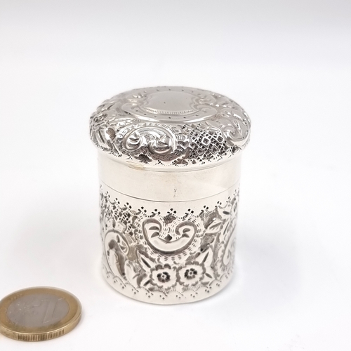60 - An early 20th century Sterling Silver cannister with repousse design throughout. Hallmarked Birmingh... 