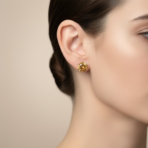 18 - Star Lot: A pretty  pair of Citrine gemstone earrings set in nine carat gold with twist mount clasps... 