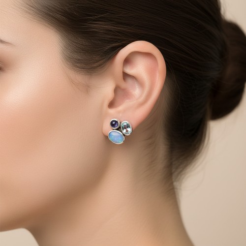 37 - A pair of Sterling Silver Three stone stud earrings with Aquamarine stones. Weight - 4 grams. Please... 