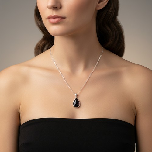 55 - A Sterling Silver facet cut gemstone pendant necklace and chain. Weight - 13 grams. Please note, the... 