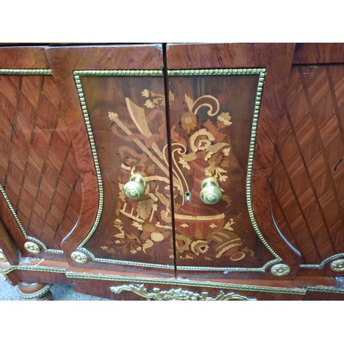 1673 - Star Lot : Serpentine mahogany sideboard with parquetry panels and floral marquetry doors, three fri... 