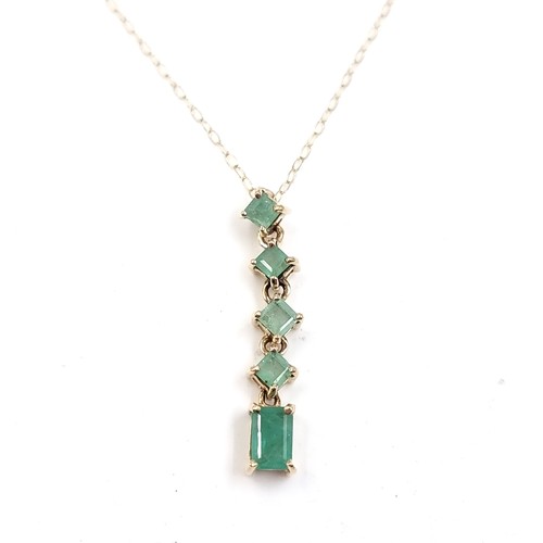 23 - A five Emerald gemstone pendant necklace set in nine carat gold. Weight - 1.75 grams. Please note, t... 