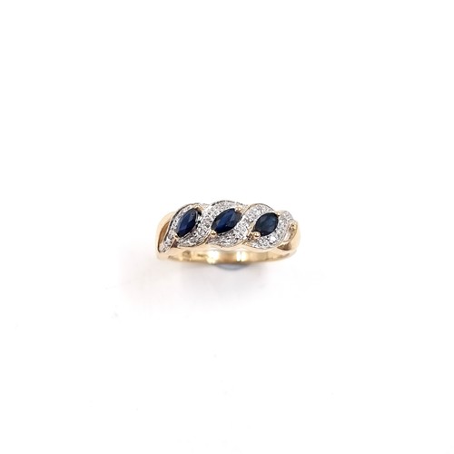 9 - Star Lot: A fine three stone Sapphire and Diamond gemstone cluster ring set in nine carat gold. Size... 