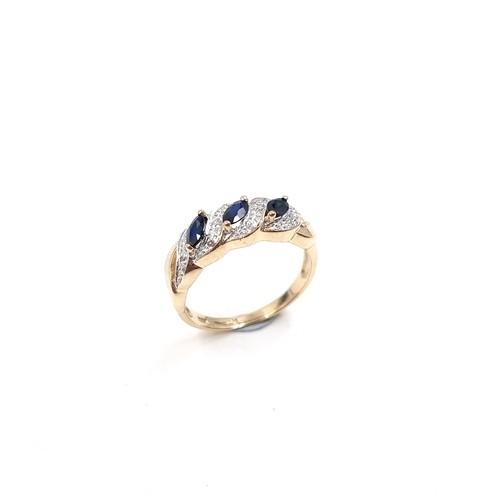 9 - Star Lot: A fine three stone Sapphire and Diamond gemstone cluster ring set in nine carat gold. Size... 
