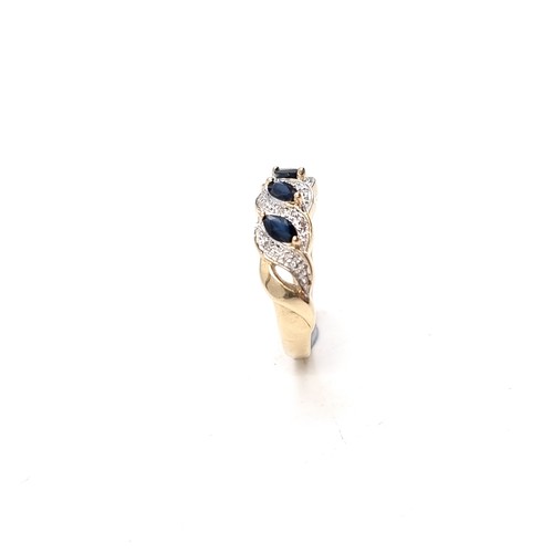 9 - Star Lot: A fine three stone Sapphire and Diamond gemstone cluster ring set in nine carat gold. Size... 