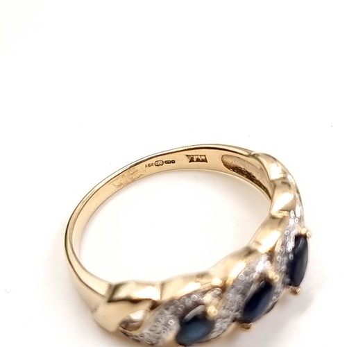 9 - Star Lot: A fine three stone Sapphire and Diamond gemstone cluster ring set in nine carat gold. Size... 