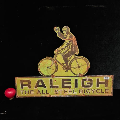 145 - A large printed metal sign reading 'Raleigh' .
Please note, the image of the modelled/ staged item w... 