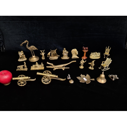 148 - A varied selection of brass collectibles.