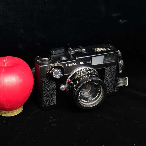 153 - Star Lot: A 'Leitz Wetzlar Leica CL 1970's 35mm' film camera. Fitted with 'Minolta M-Rokkor 1:2 f=40... 