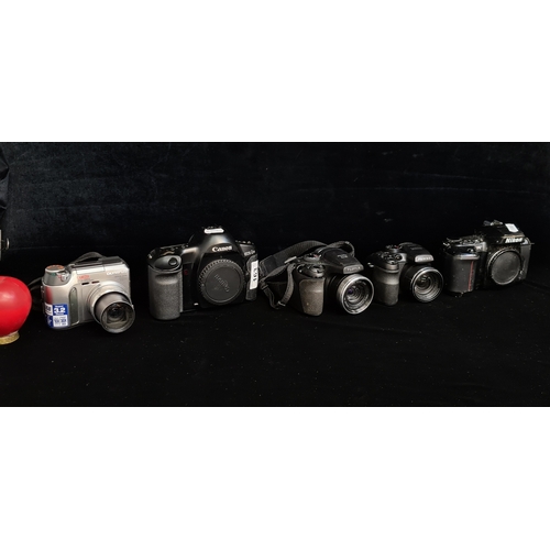 163 - A selection of five cameras, includes a canon EOS-1N, a Nikon F-601 and a FujiFilm S100FD.