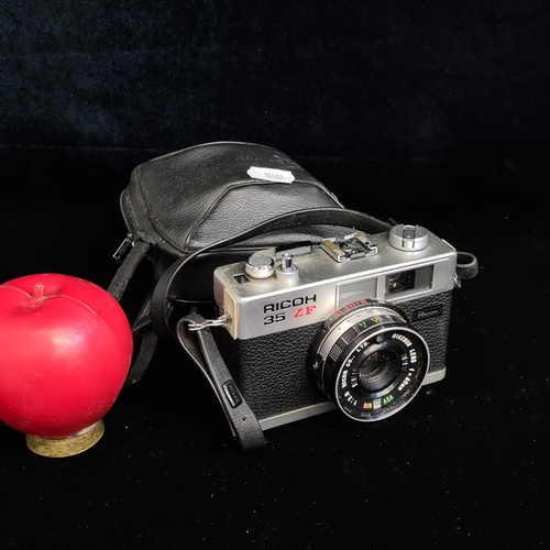 167 - A vintage 'Ricoh 35mm ZF' camera with carry case.