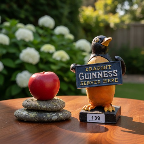 139 - A charming advertising Penguin sculpture for Guinness sat atop a square plinth base.
Please note, th... 