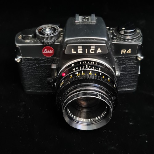 154 - Star Lot: A Leitz Leica R4 35mm film SLR camera fitted with a Summicron R 1:2/50 lens. RRP €859.