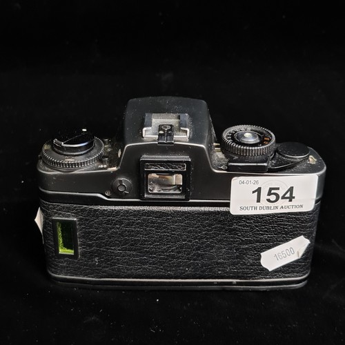 154 - Star Lot: A Leitz Leica R4 35mm film SLR camera fitted with a Summicron R 1:2/50 lens. RRP €859.