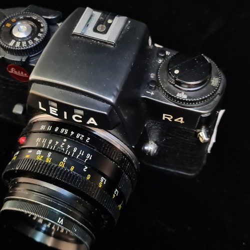 154 - Star Lot: A Leitz Leica R4 35mm film SLR camera fitted with a Summicron R 1:2/50 lens. RRP €859.