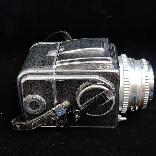 159 - Super Star Lot: A 'Hassleblad 500c medium format' film camera fitted with a 'Carl Zeiss 1:2.8/ 80 mm... 
