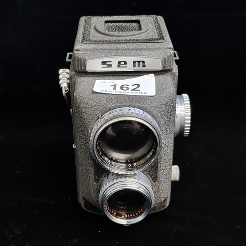 162 - Star Lot : An 'SEM Semflex TLR' studio medium format 120 film camera. RRP:€599 
Short History of the... 