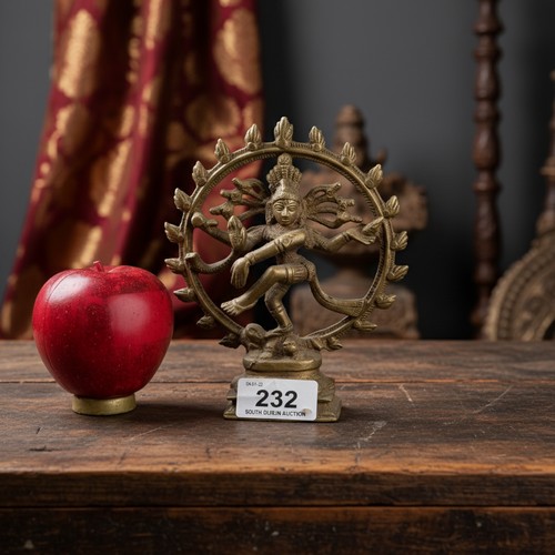 232 - A brass toned detailed sculpture of the Hindu god Shiva Nataraja, also known as the Lord of the Danc... 