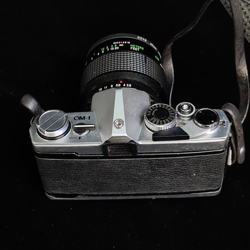 172 - An Olympus OM-1 1970's 35mm film SLR camera. Fitted with Vivitar 1:2.8/50mm auto macro lens. Appear ... 