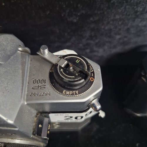 209 - Star Lot: Three vintage film cameras including a Nikon FM €321, a Pentax asahi SP 1000 €153
, and a ... 