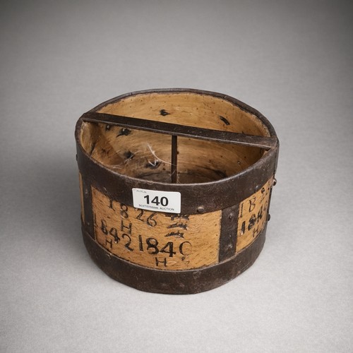 140 - A fascinating early 19th century wooden and wrought iron grain measure. With several stamped dates d... 